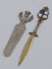 A silver book mark with thistl