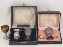 A silver boxed egg cup and spoon