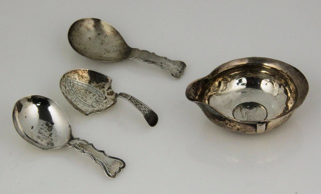 A silver caddy spoon John