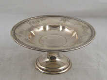 A silver cake dish by Gorham
