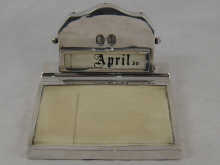 A silver calendar with