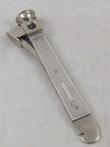A silver cased cigar cutter