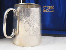 A silver christening mug of