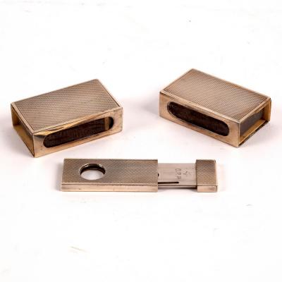 A silver cigar cutter, marked