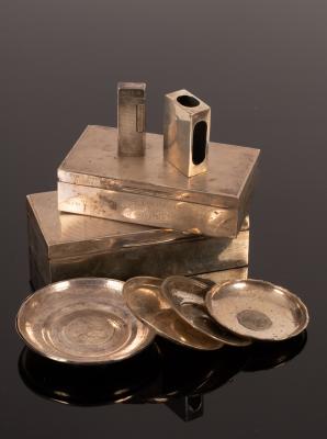 A silver cigarette box, marks