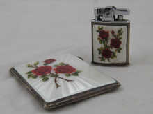 A silver cigarette case decorated