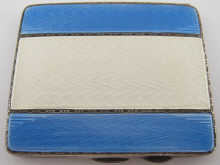 A silver cigarette case decorated