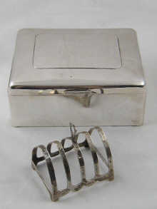 A silver cigarette/cigar box