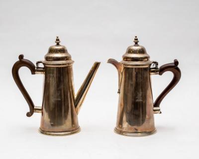 A silver coffee pot and teapot,
