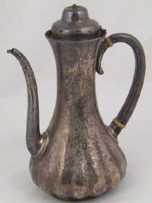 A silver coffee pot by Tiffany &