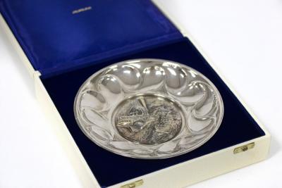A silver commemorative plate,