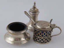 A silver condiment set comprising