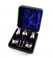 A SILVER CONDIMENT SET Compris