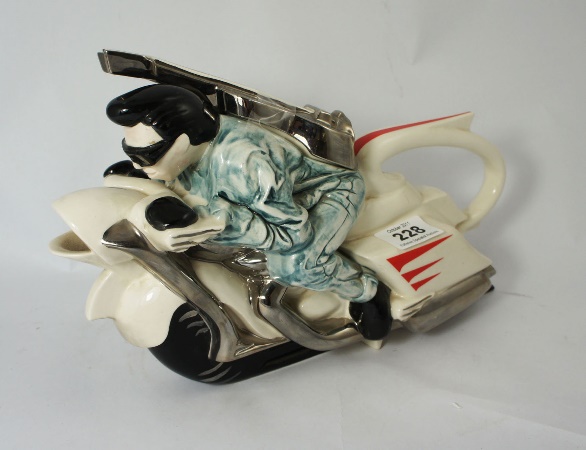 A Silver Crane Teapot of Elvis on a