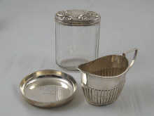 A silver cream jug a pin tray