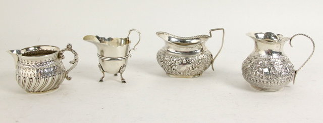 A silver cream jug London 1896 of