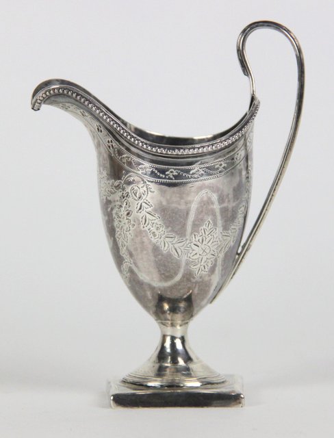 A silver cream jug Peter and Ann
