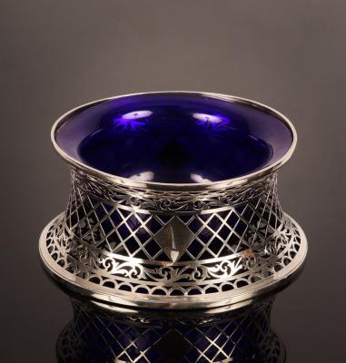A silver dish or potato ring,