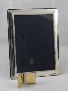 A silver double miniature photo