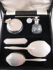A silver dressing table set