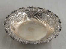 A silver embossed and pierced bon