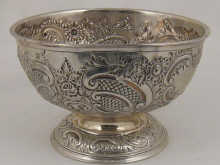 A silver embossed rose bowl