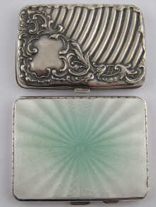 A silver engine turned cigarette