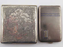 A silver engine turned cigarette