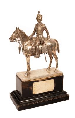A silver figure of a Royal