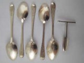 A silver four bladed apple cor