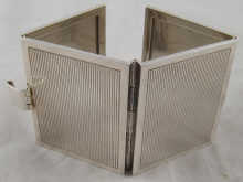 A silver four fold travelling photo