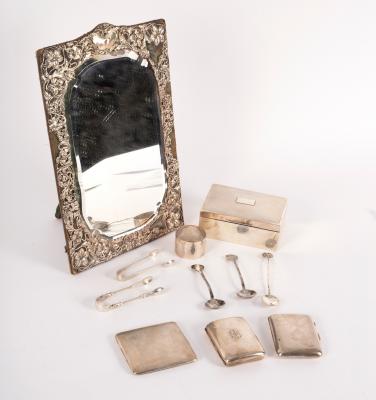 A silver framed mirror, with shaped