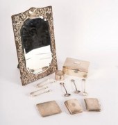 A silver framed mirror, with s