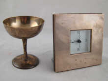 A silver fronted clock approx. 12 x