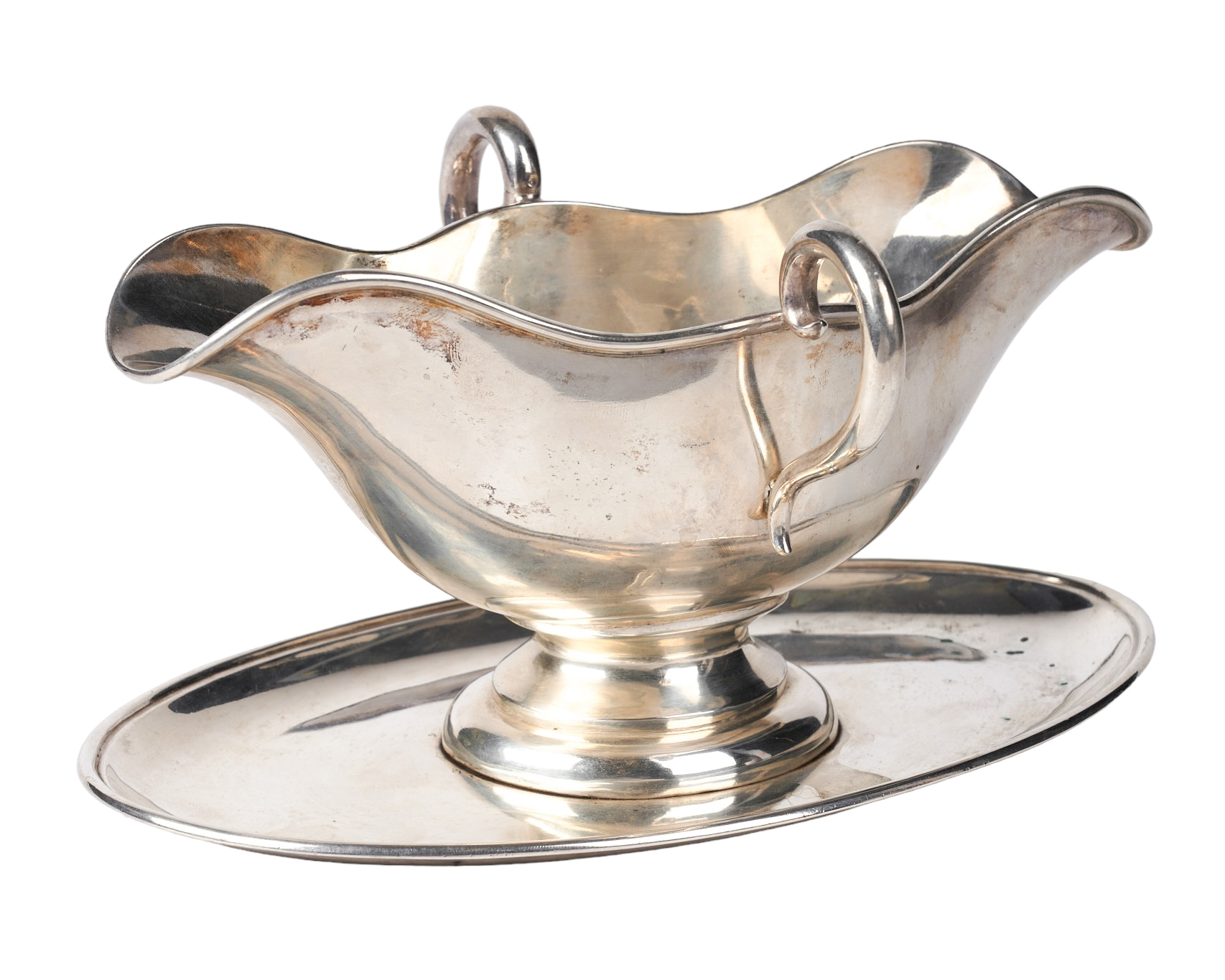 A silver gravy boat with undertray,