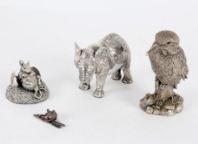 A silver model of an elephant, a
