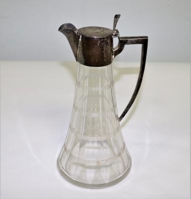 A silver mounted claret jug,