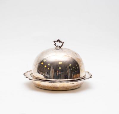 A silver muffin dish and cover,