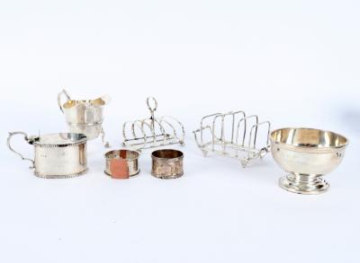 A silver mustard pot and cover,