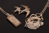 A silver pendant modelled as a