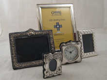 A silver photo frame 24 x 19 cm