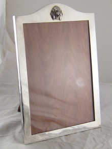 A silver photo frame the curved