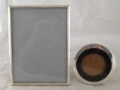 A silver photo frame with stru