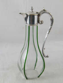 A silver plate mounted claret jug