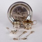 A silver plate with design by