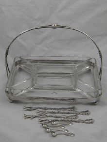 A silver plated entree serving dish