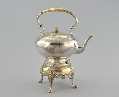 A Silver Plated Hot Water Kettle on