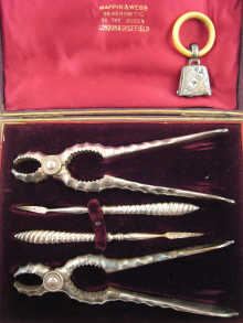 A silver plated lobster picks and