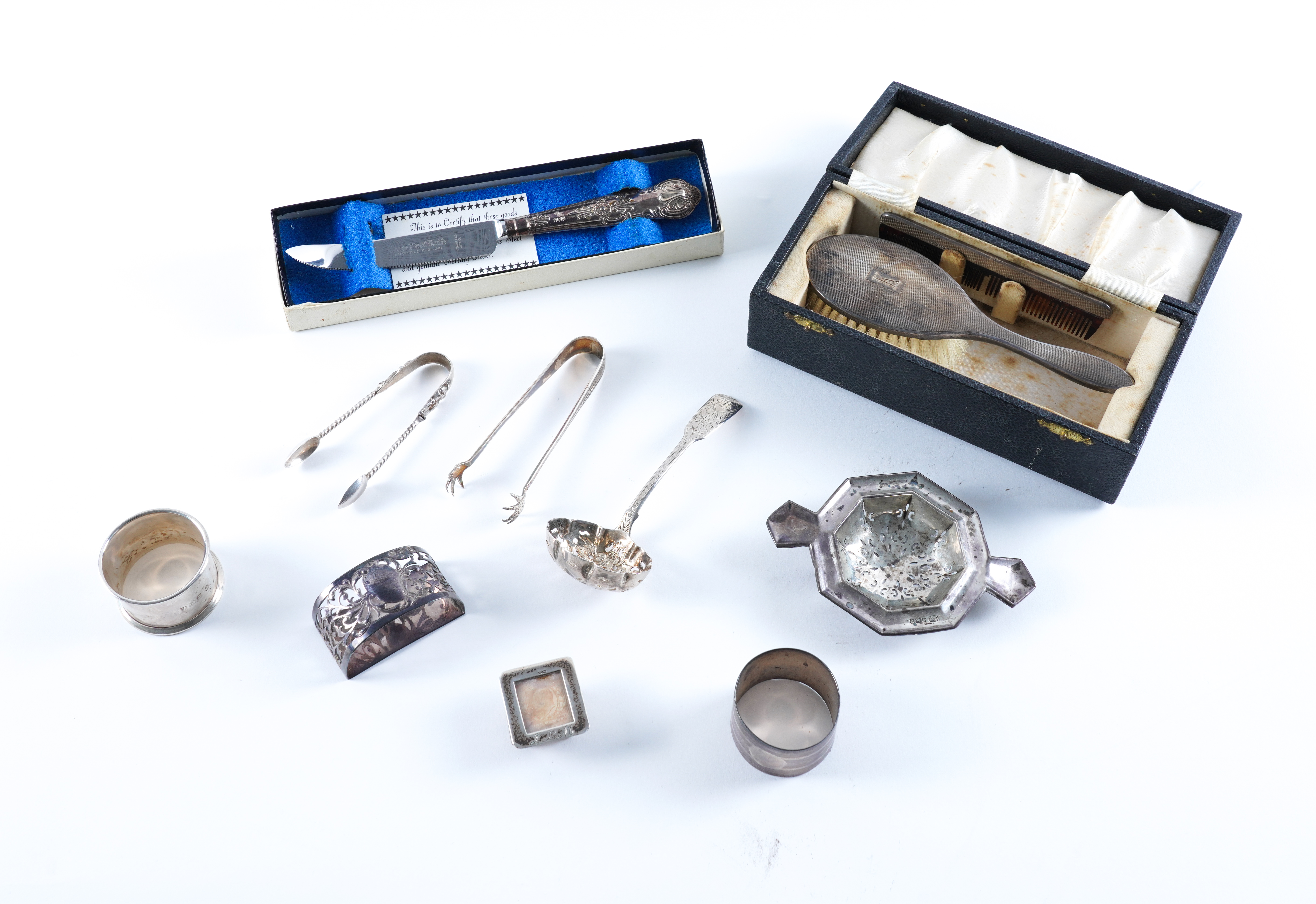 A SILVER POSTAGE STAMPS BOX AND TEN