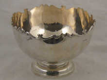 A silver punch bowl with